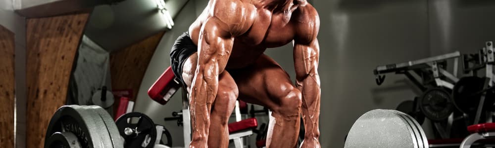 Bodybuilder flexing muscles after a strength training workout.