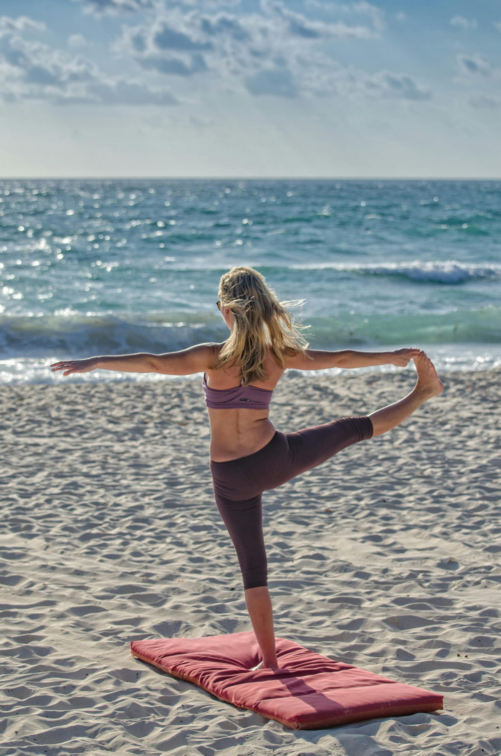 Group fitness HIIT class with a personal trainer outdoors