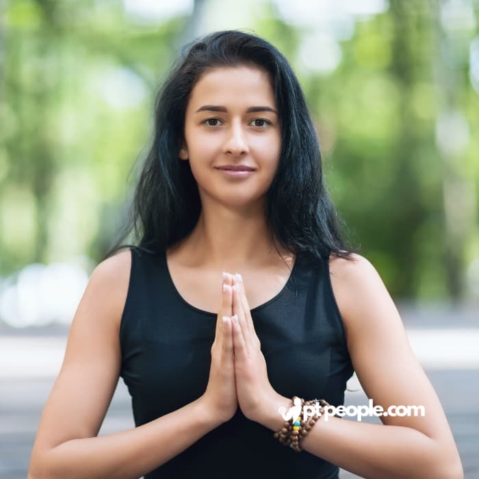oga instructor leading a calming outdoor yoga session