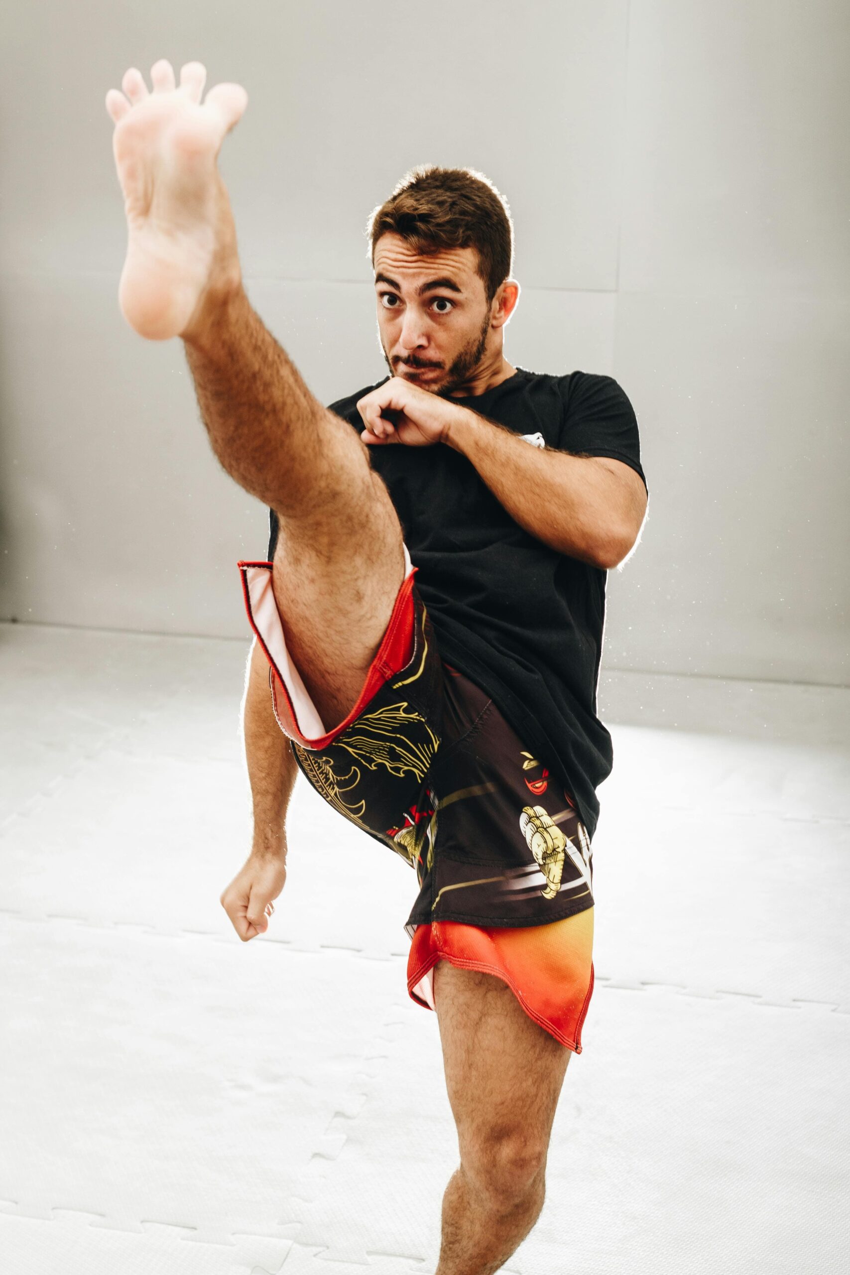 Instructor fitness kickboxing class with energetic participants