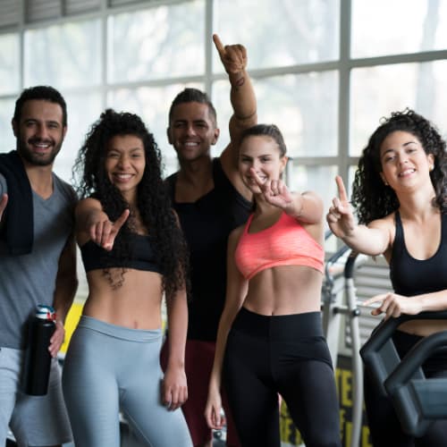 Personal trainer in Dubai working one-on-one with a client in a gym.